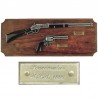 Miniatures of rifle and revolver on wall wooden board (39cm)