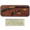 Miniatures of rifle and revolver on wall wooden board (39cm)